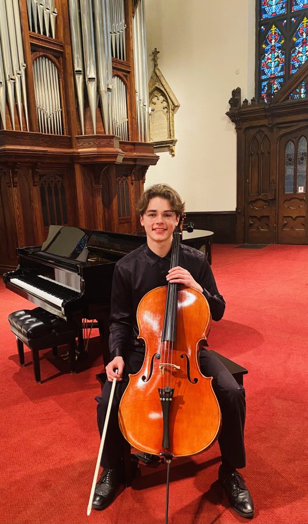 2024 Madura String Scholarship Winner Ethan Snapper, seated with cello